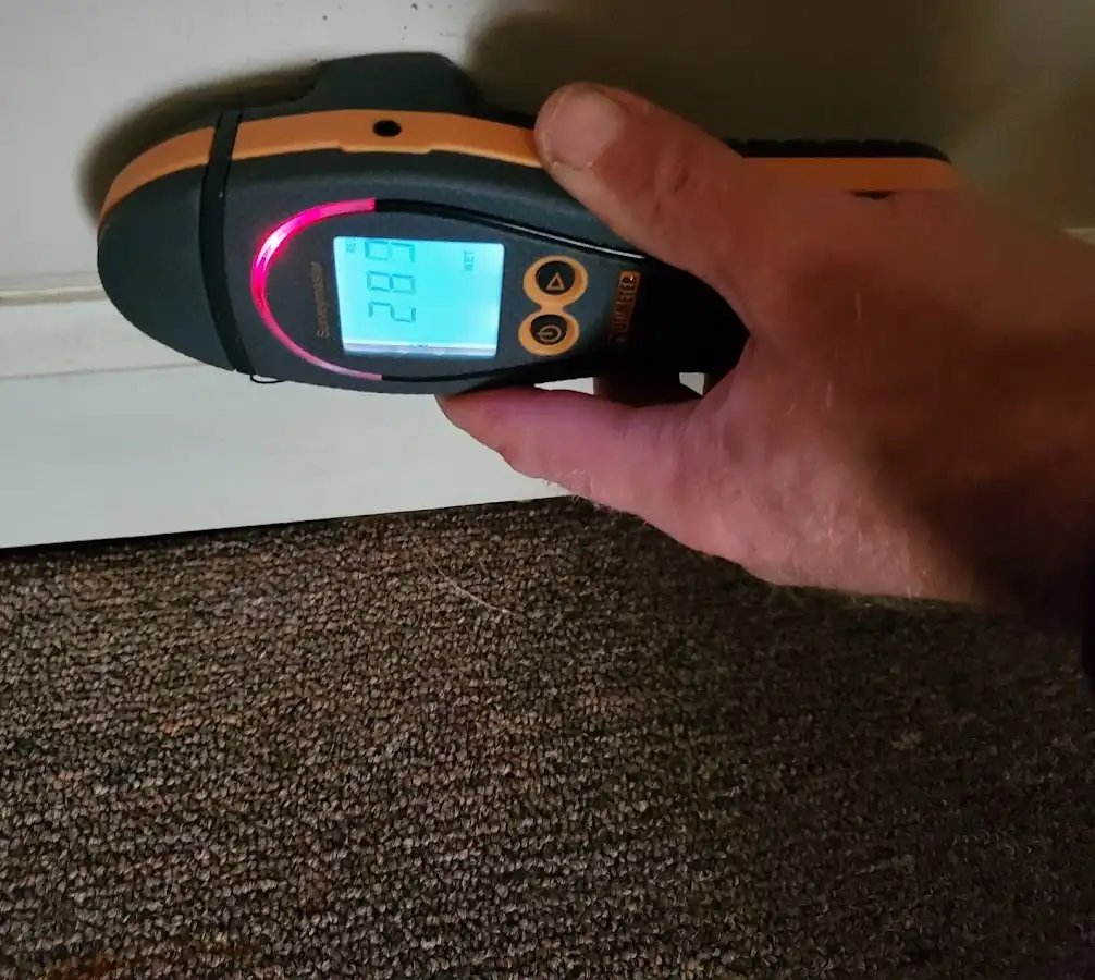 Moisture detection at baseboard during Storm Damage Restoration in Weisenberg